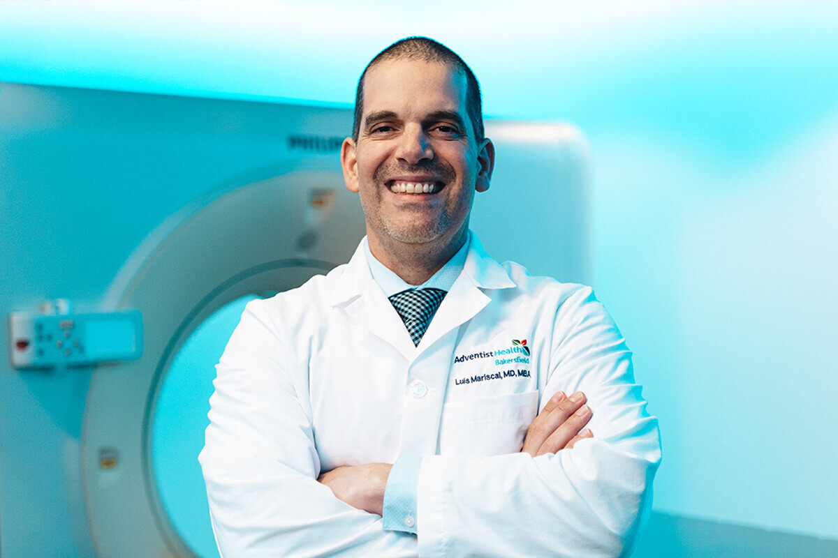 Male Doctor In Front Of Imaging Machine